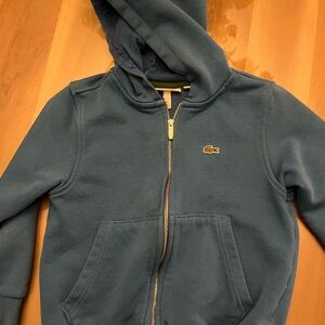 Blue Lacoste sweatshirt . Size 6 , pet and smoke free home , excellent condition